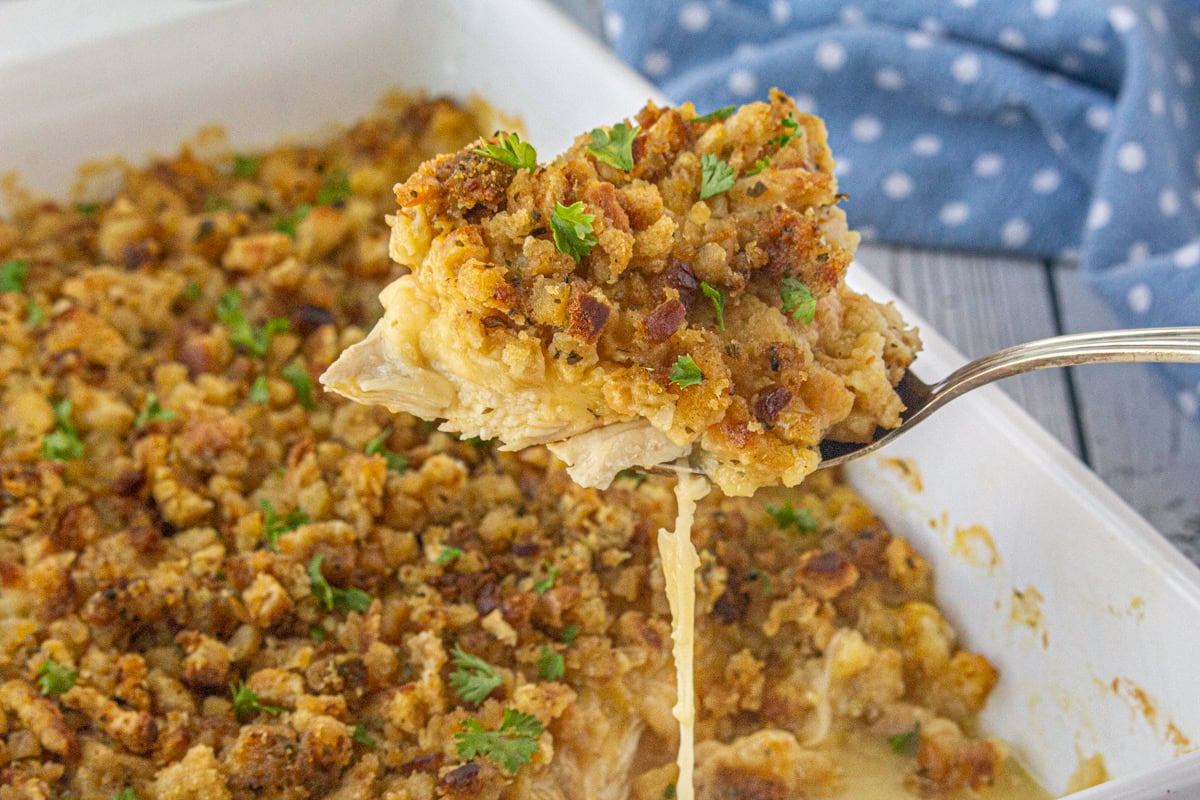 A serving of Swiss chicken & stuffing casserole being served.