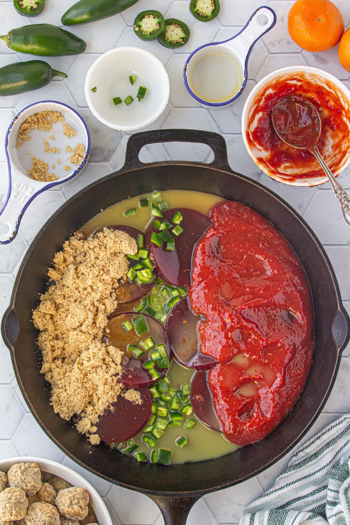 The cranberry sauce ingredients in a pan.