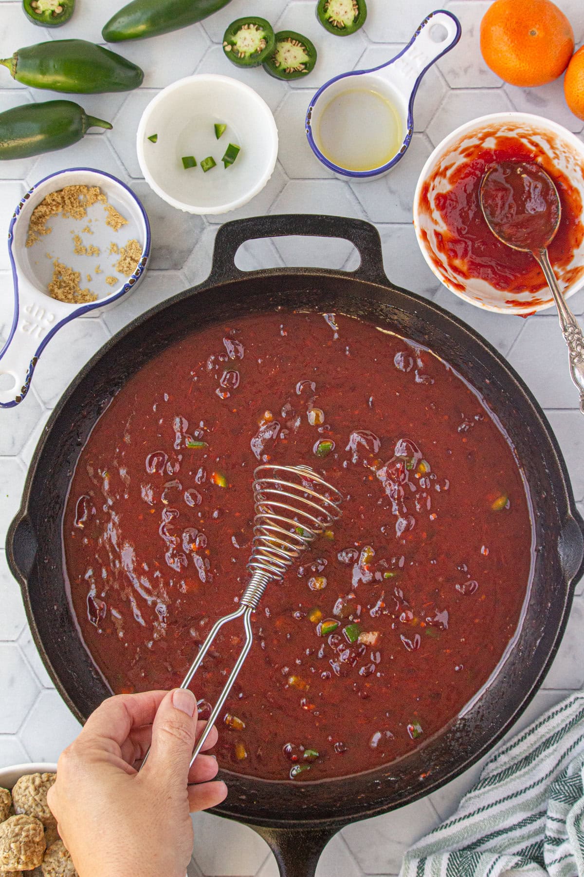 Whisking the sauce ingredients together.