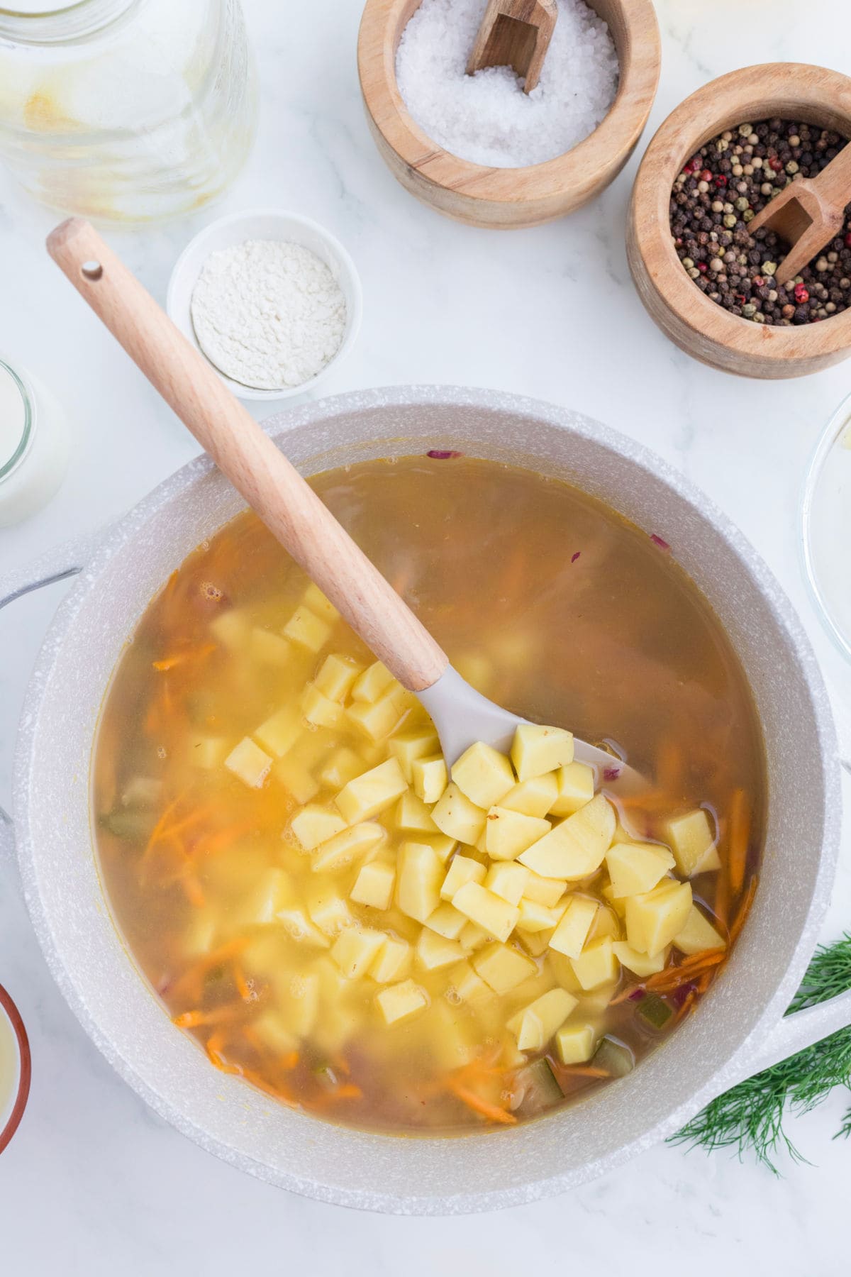 Potatoes are added to th soup.