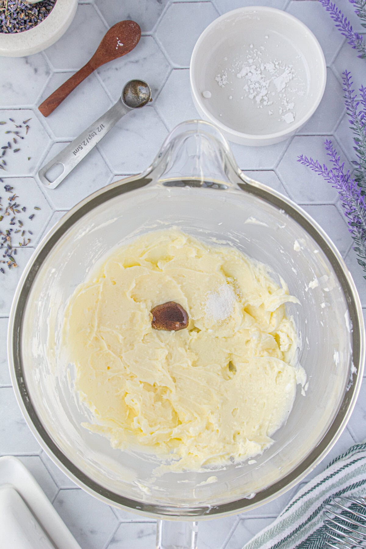 Beating the butter and other ingredients together.