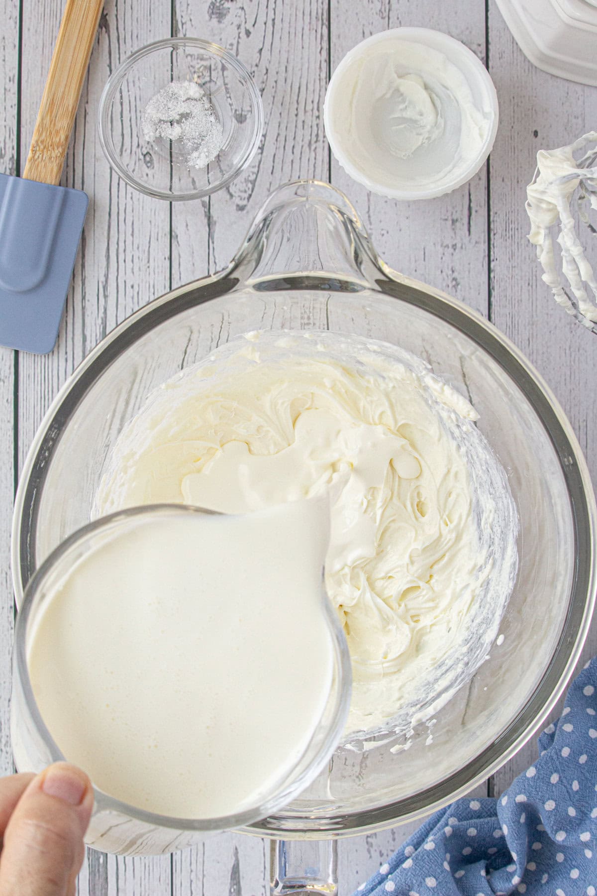 Heavy cream being poured into the other ingredients.