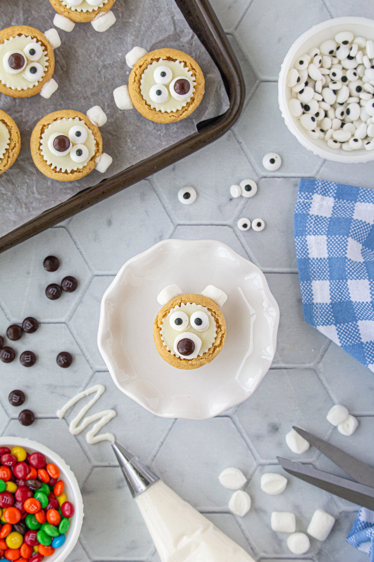 A brown M&M added to the marshmallow as the bear's snout.