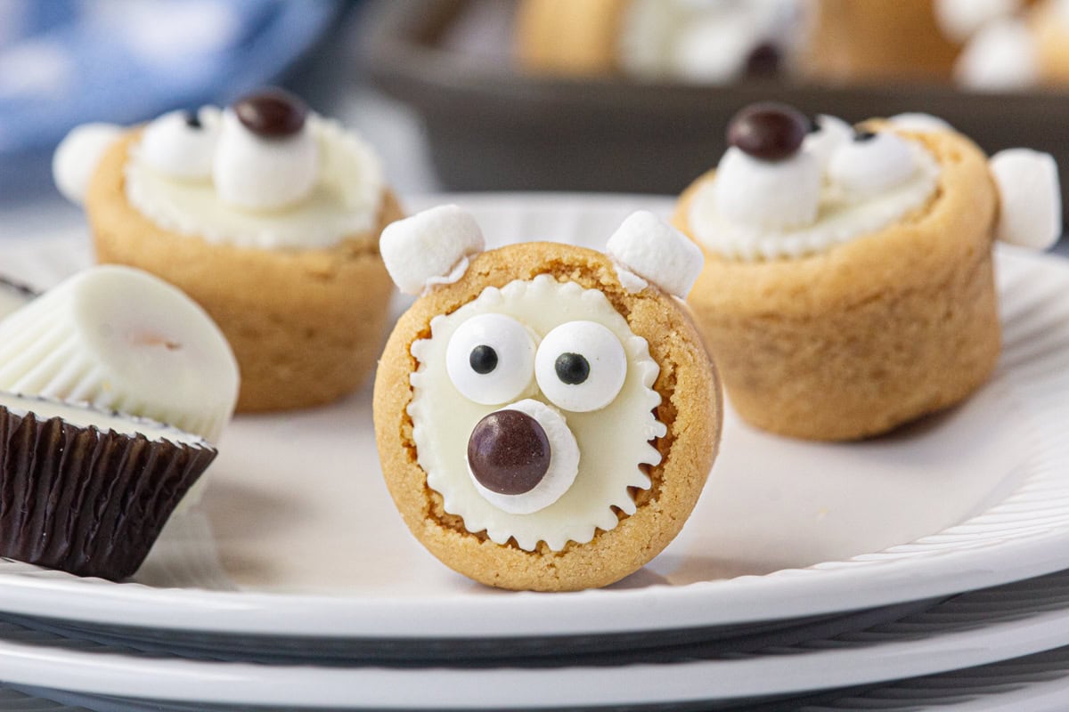 An up-close photo of a polar bear cookie on a plate.