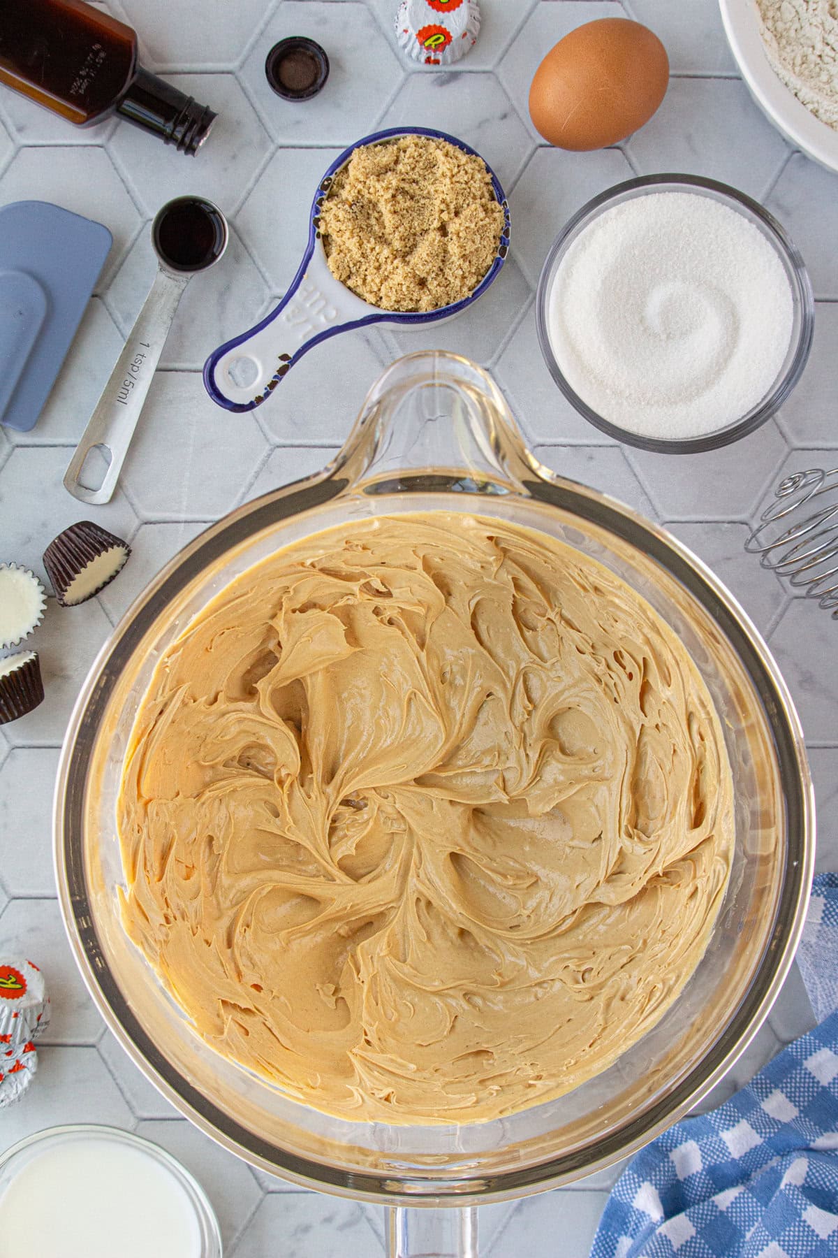 The peanut butter and butter beaten in a mixing bowl.