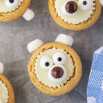 Closeup of polar bear cookies on a cookie sheet.