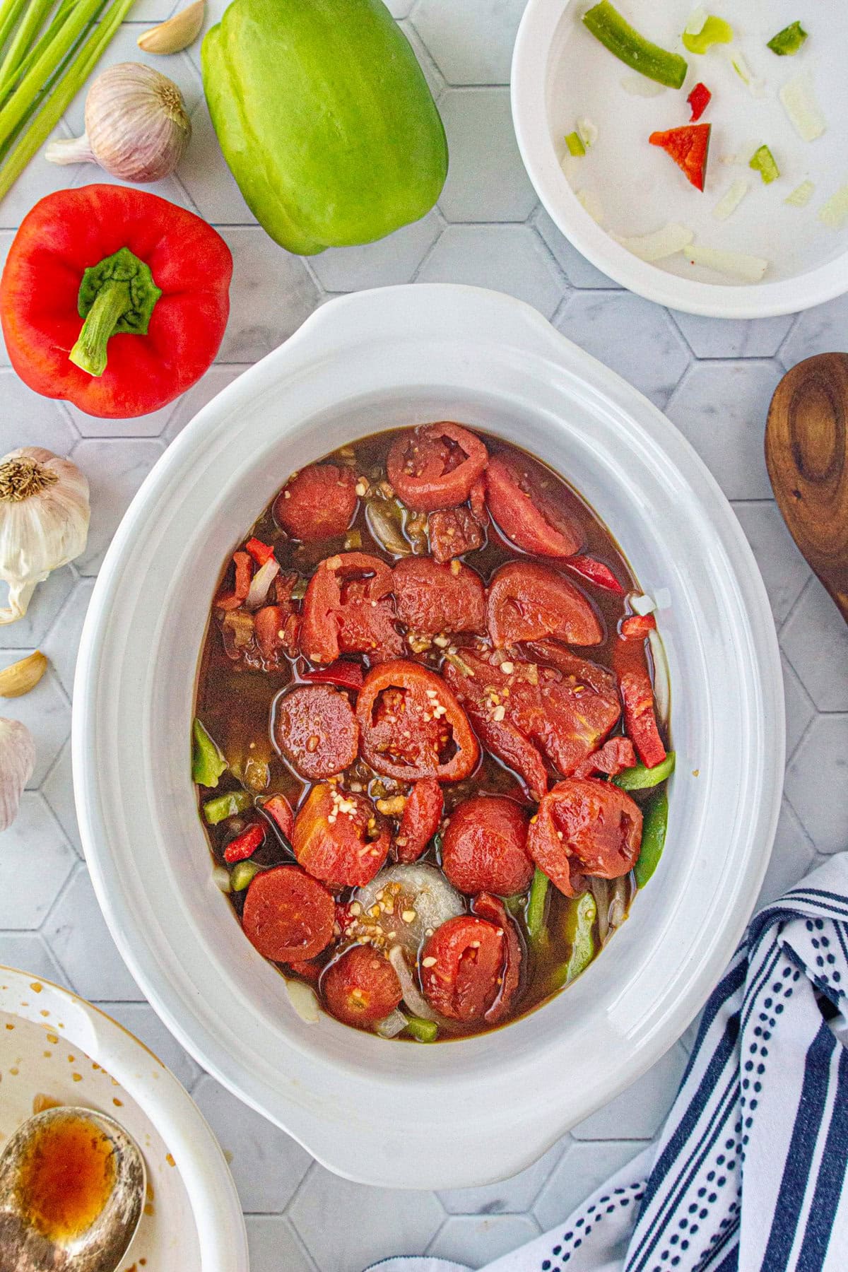 The pepper steak sauce added to the slow cooker.