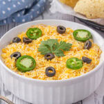 Taco dip in a white bowl.