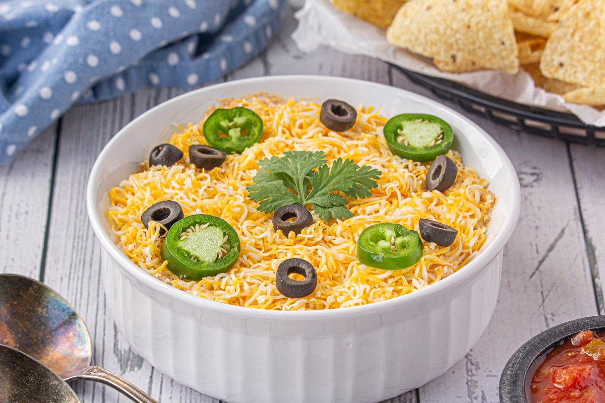 Taco dip in a white bowl.