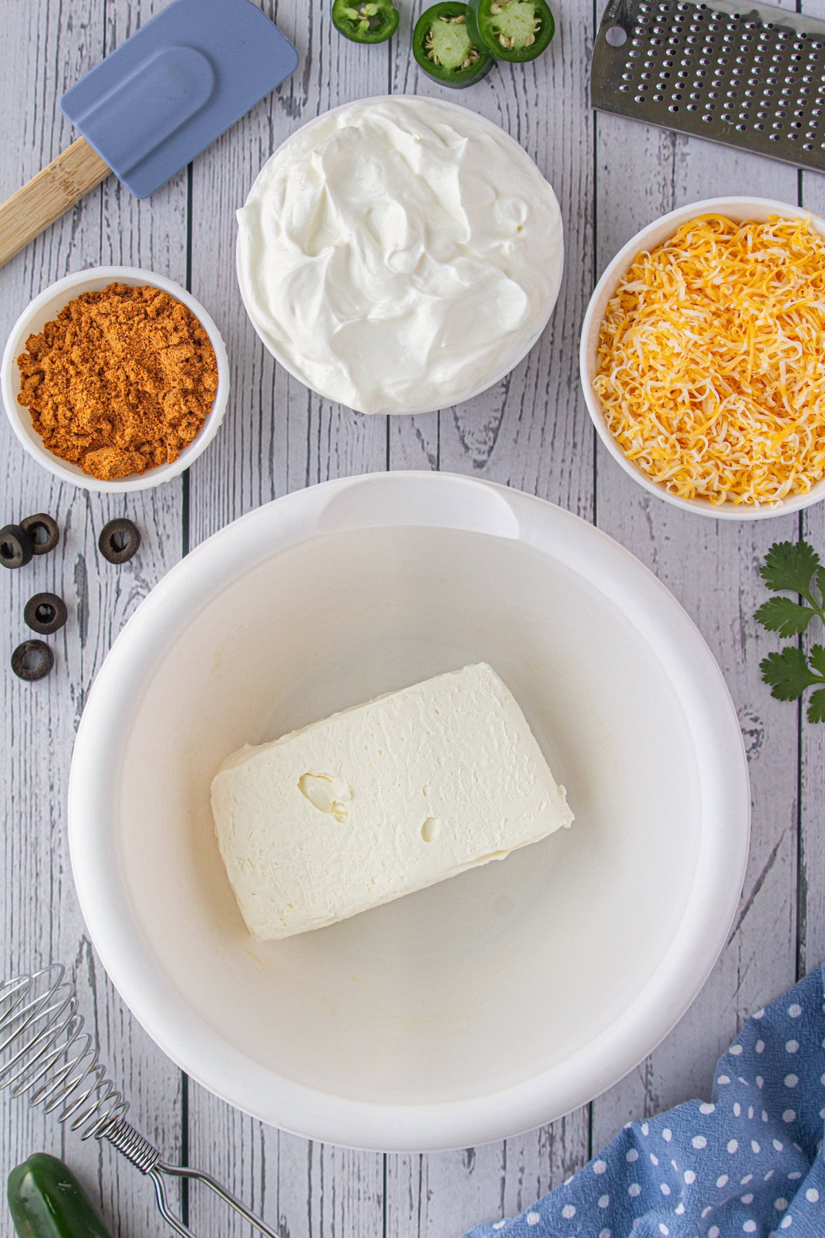 Softened cream cheese in a mixing bowl.