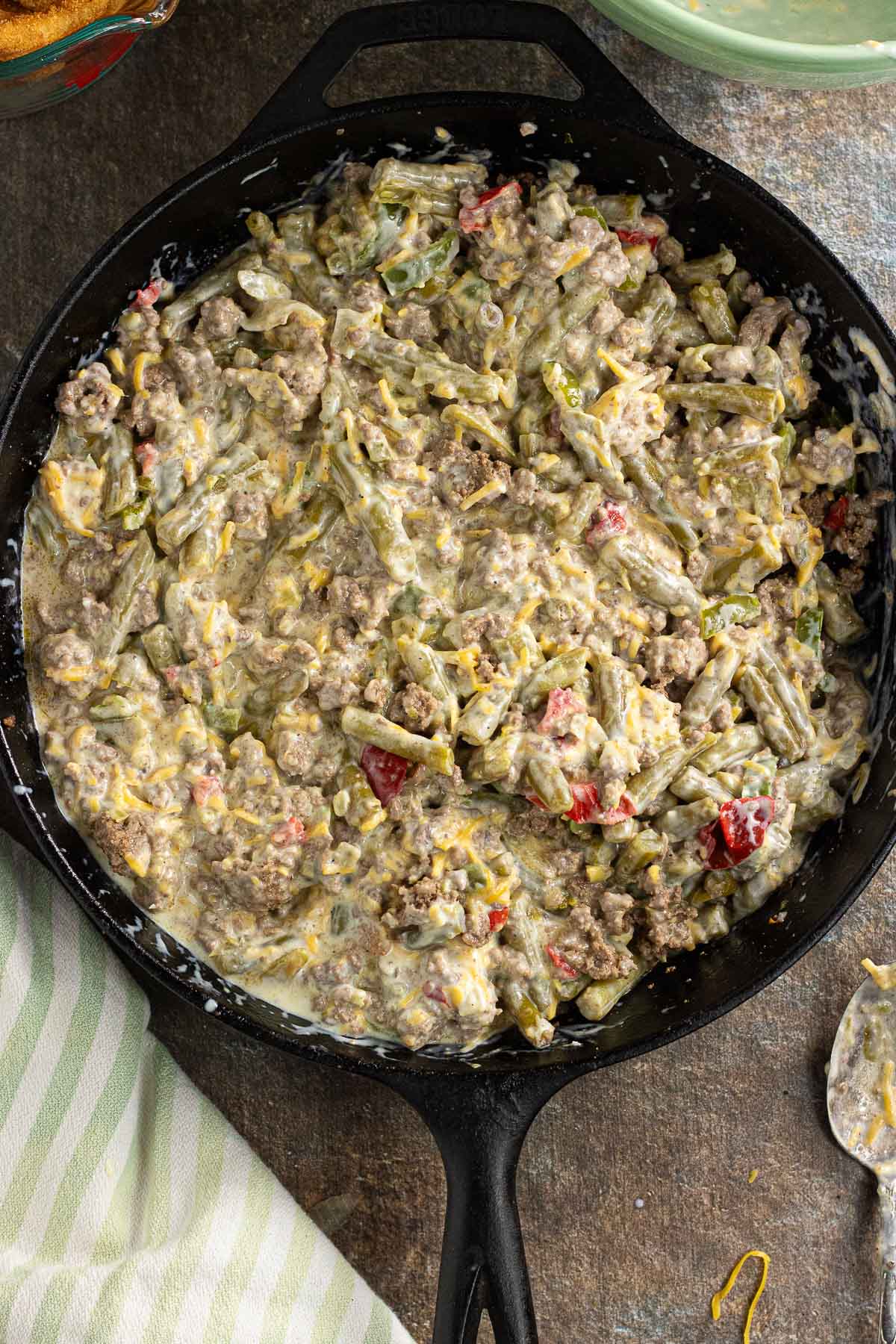 The green bean and ground beef mixture combined with the soup, cheese, and milk. 