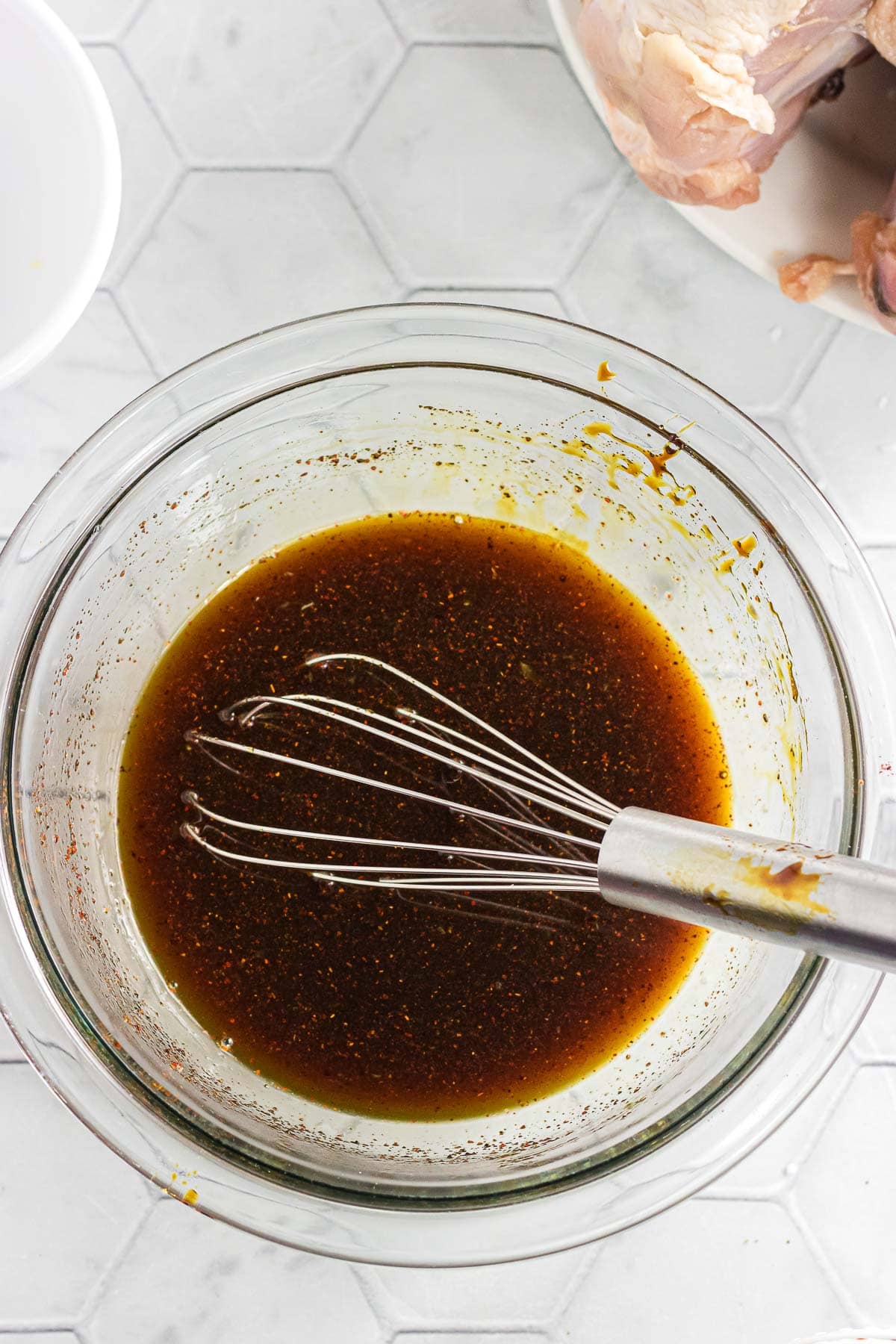 Whisking the orange juice, brown sugar, molasses, and chipotle together.