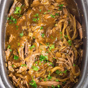 Overhead view of French Onion Pot Roast in the slow cooker.