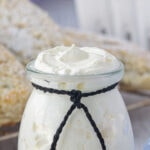 A jar of clotted cream with title text overlay for Pinterest.