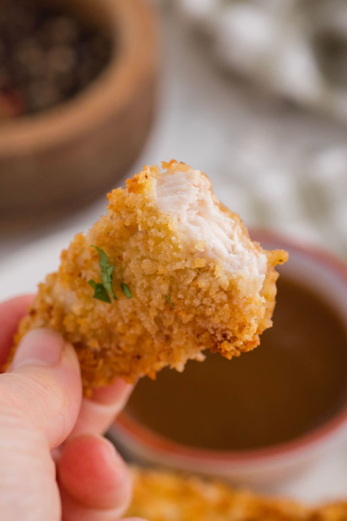 Crispy chicken tender showing the juicy interior.