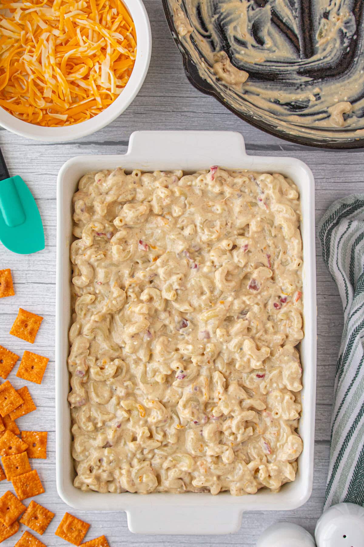 The bacon pimento mac and cheese spread into a baking dish.