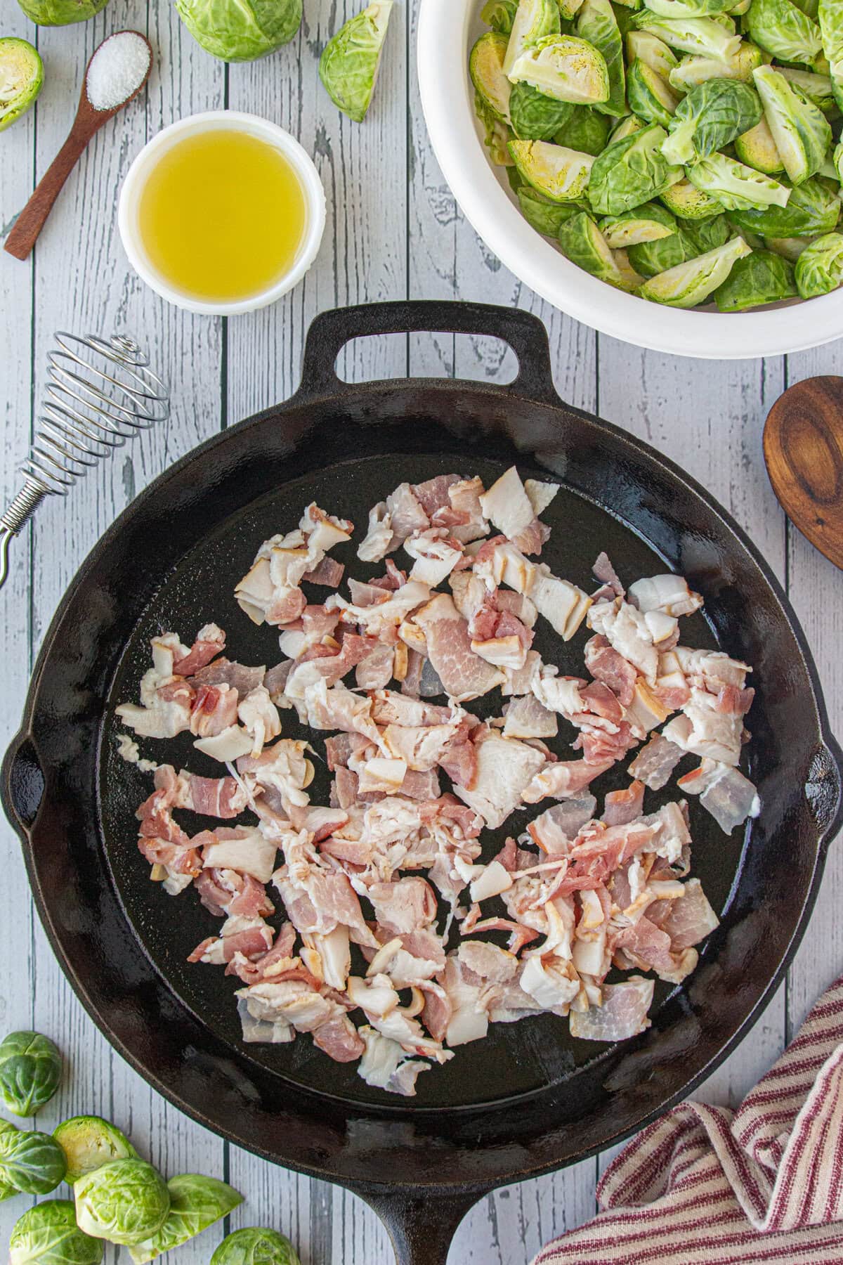 Cooking the chopped bacon in a skillet.