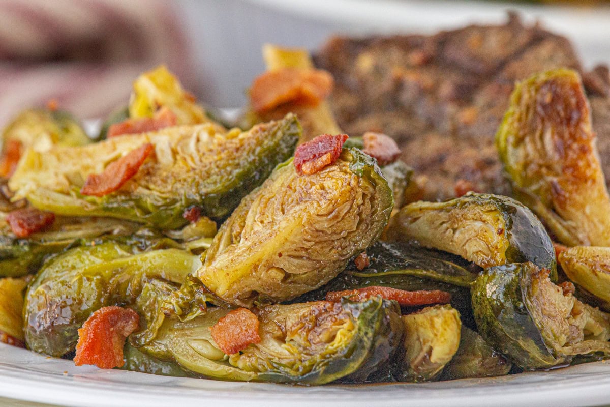 Closeup of brussels sprouts with hot bacon dressing.