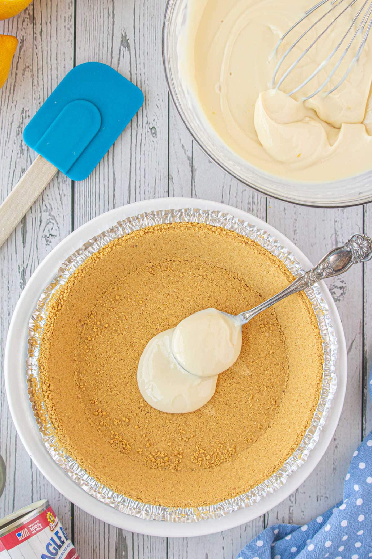 Filling is added to a graham cracker crust.