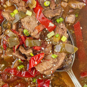 Closeup of slow cooker pepper steak in a crockpot.