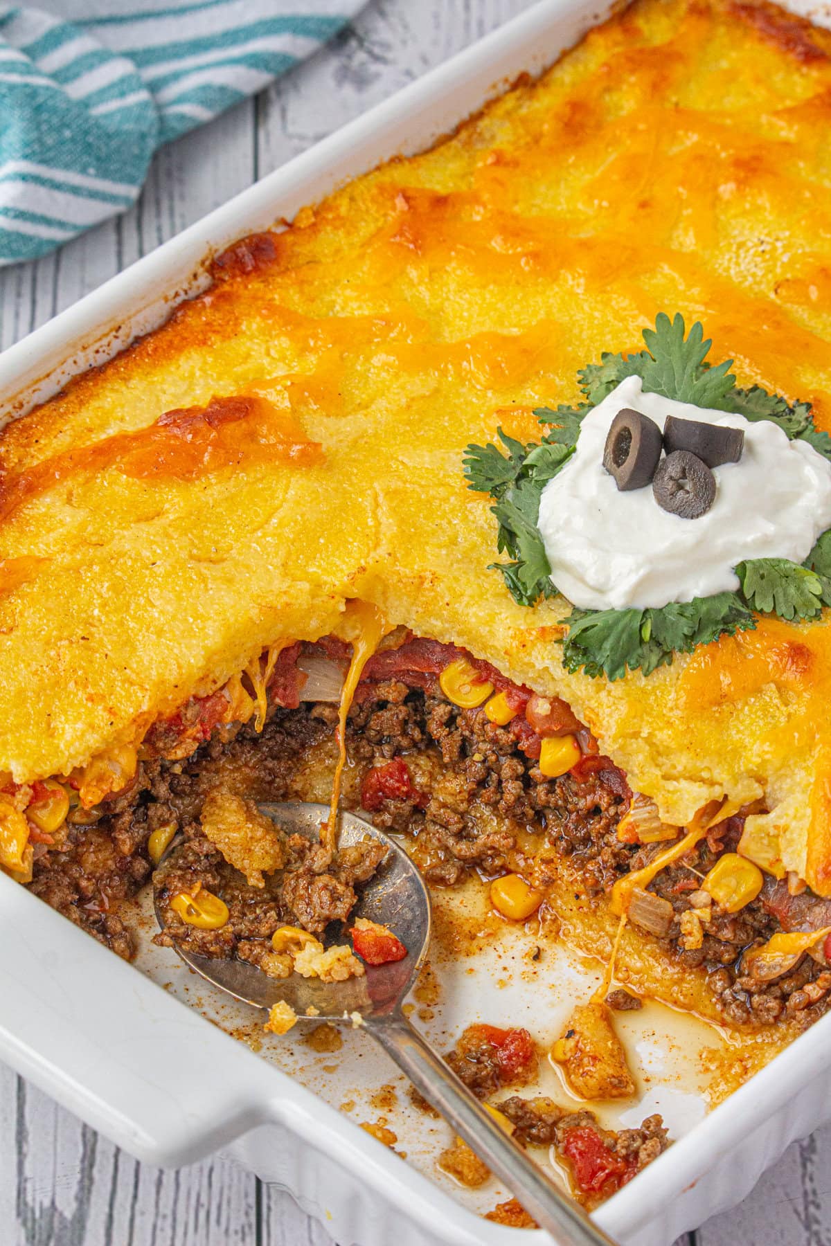 Tamale Pie with a serving removed to show the filling.