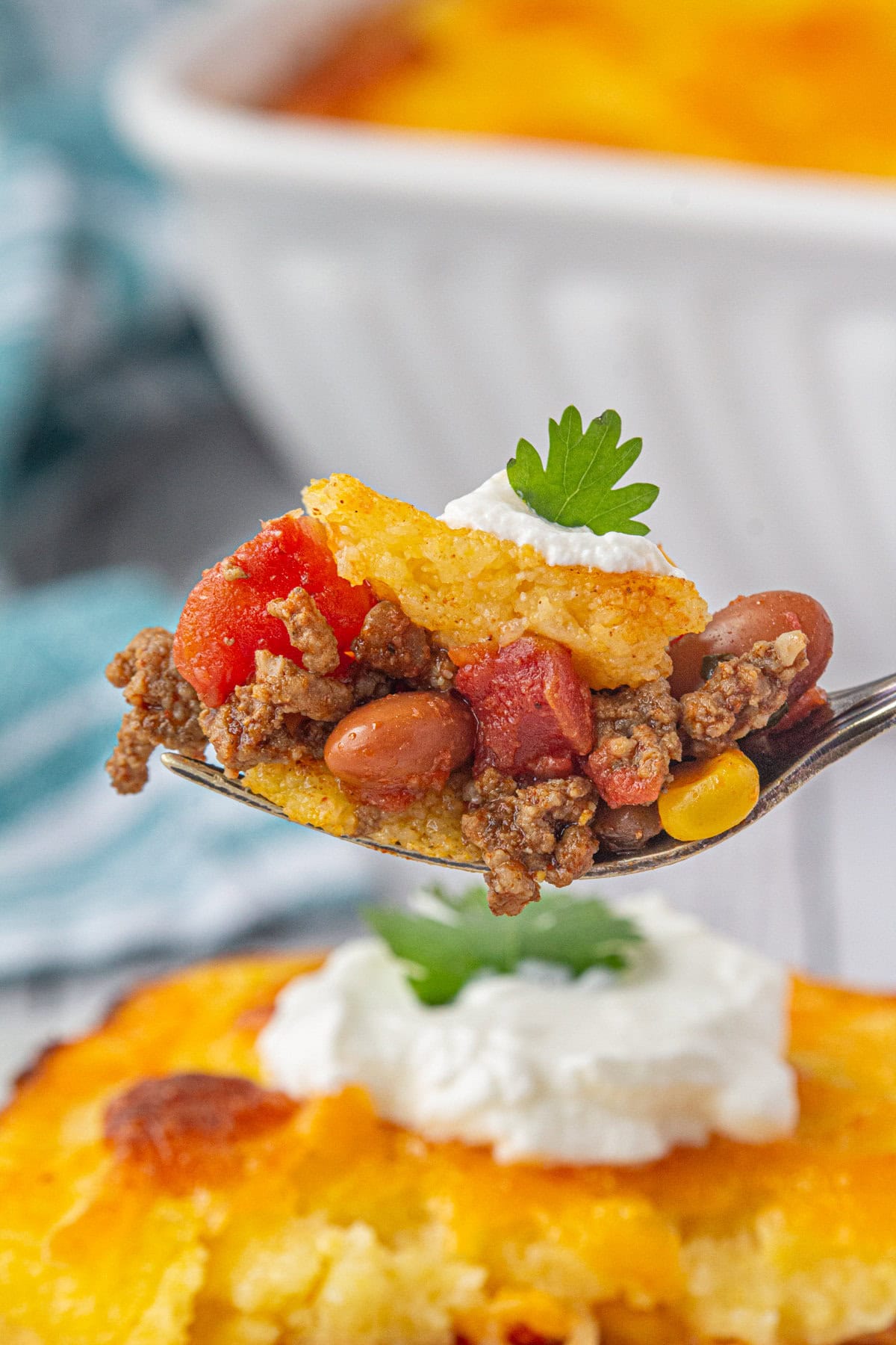 A closeup of tamale pie on a fork.