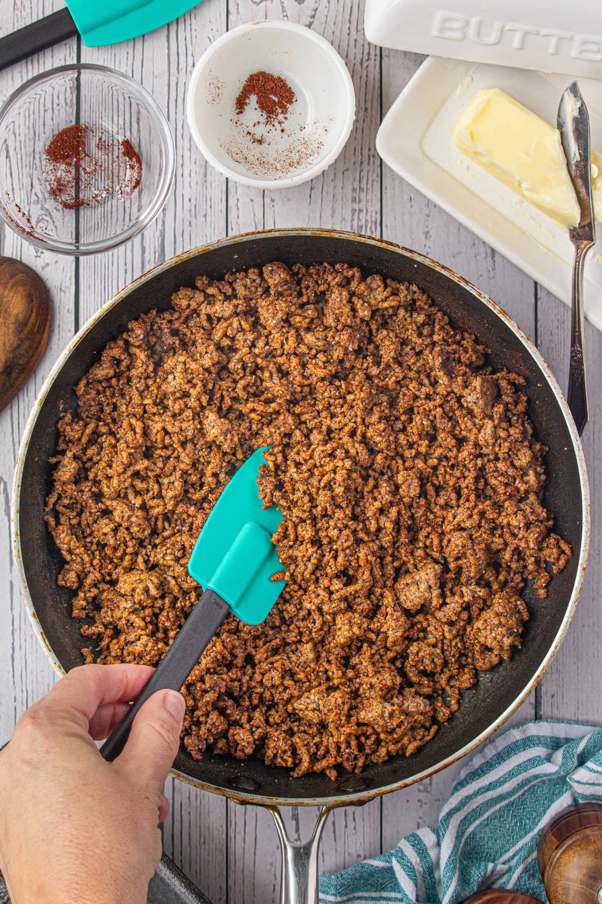 The cooked ground beef in the skillet.