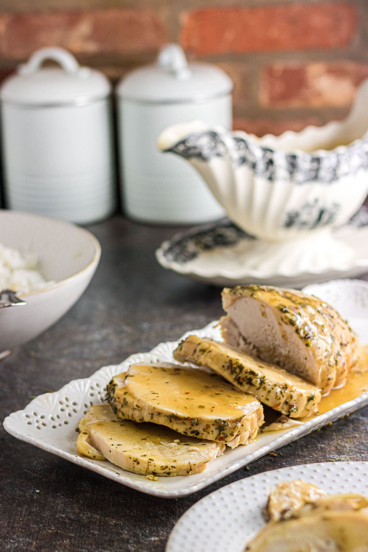 An angled view of sliced slow cooker boneless turkey breast.