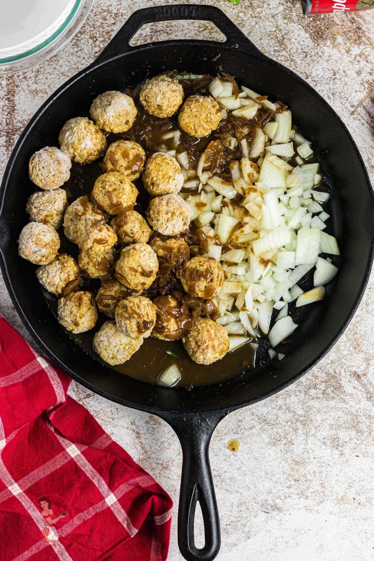 French onion soup is added to the skillet.