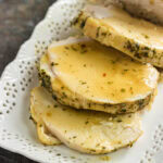 Closeup of sliced turkey breast on a platter.