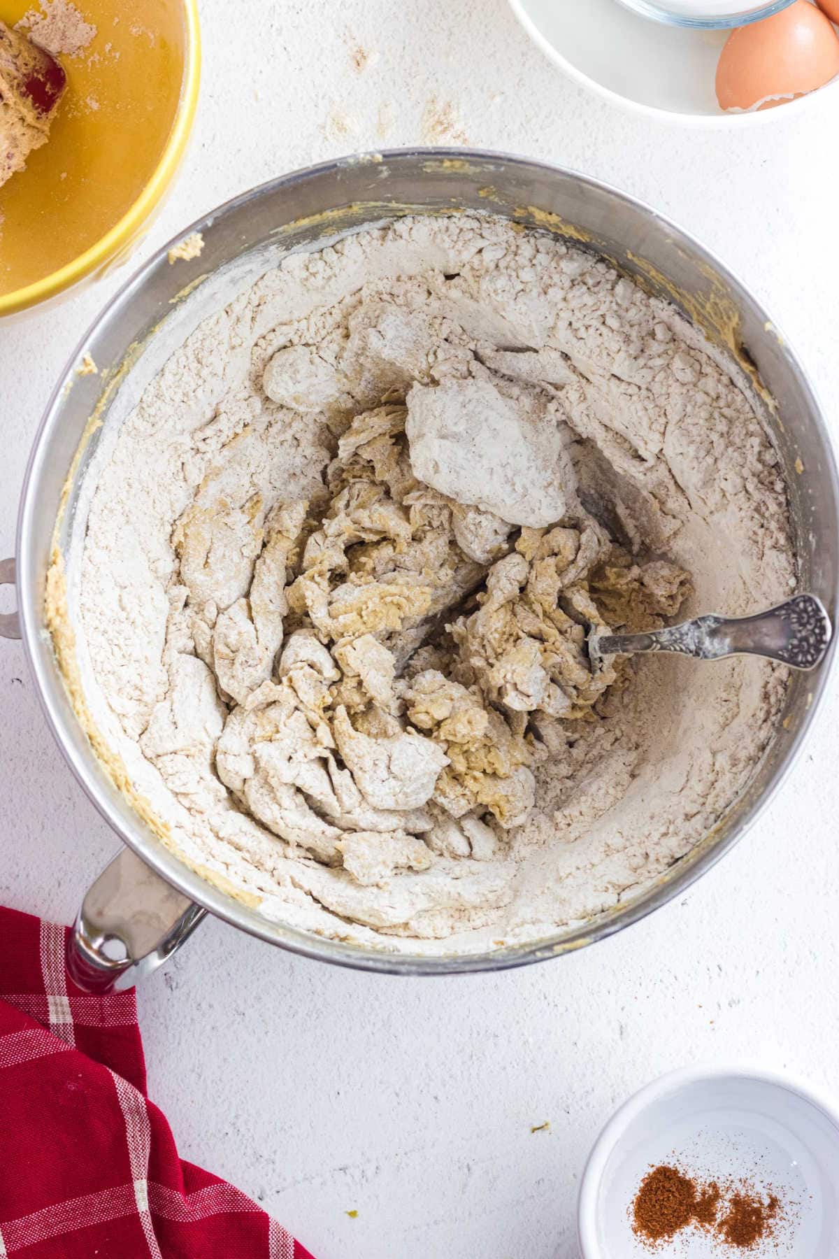 Flour mixture being mixed into butter mixture.