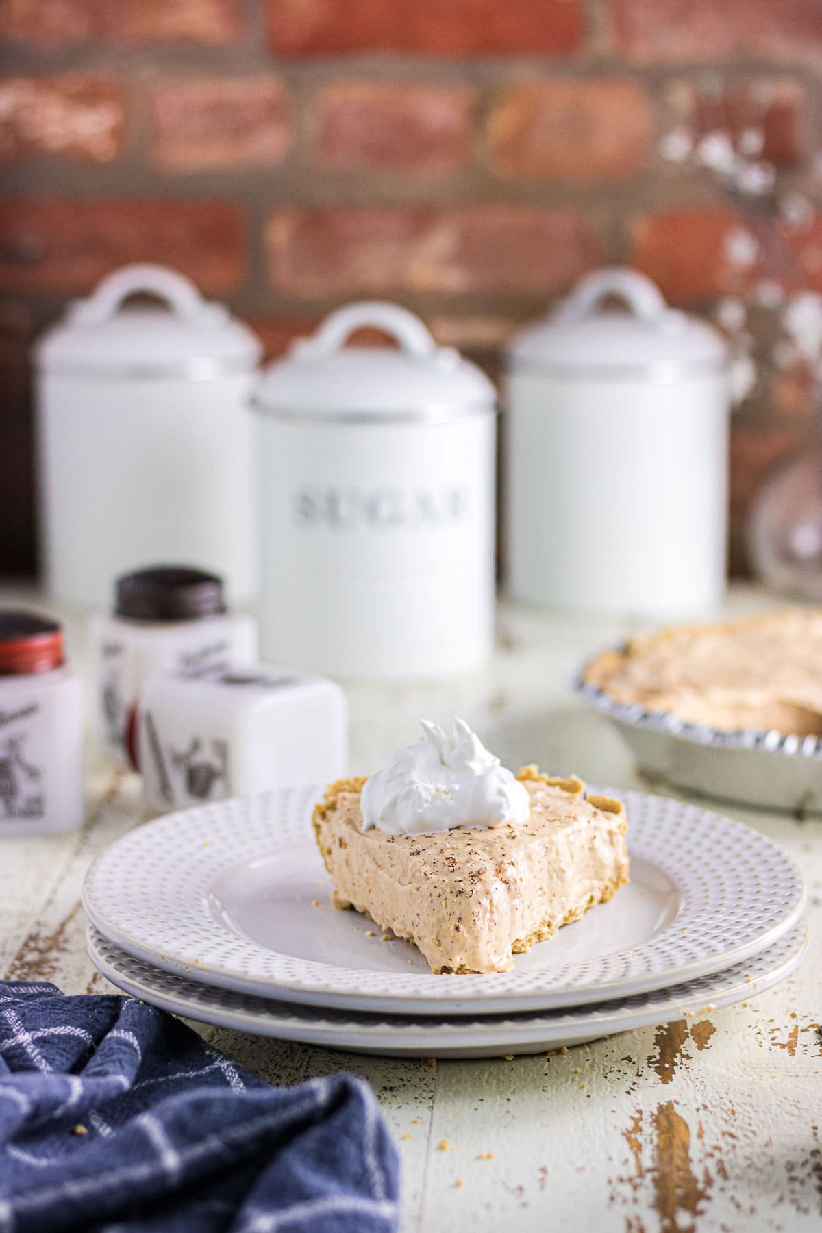 An angled view of a slice of no-bake sweet potato icebox pie on a dessert plate.