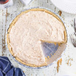 Overhead view of sweet potato pie with a slice removed.