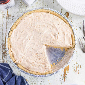 Overhead view of sweet potato pie with a slice removed.