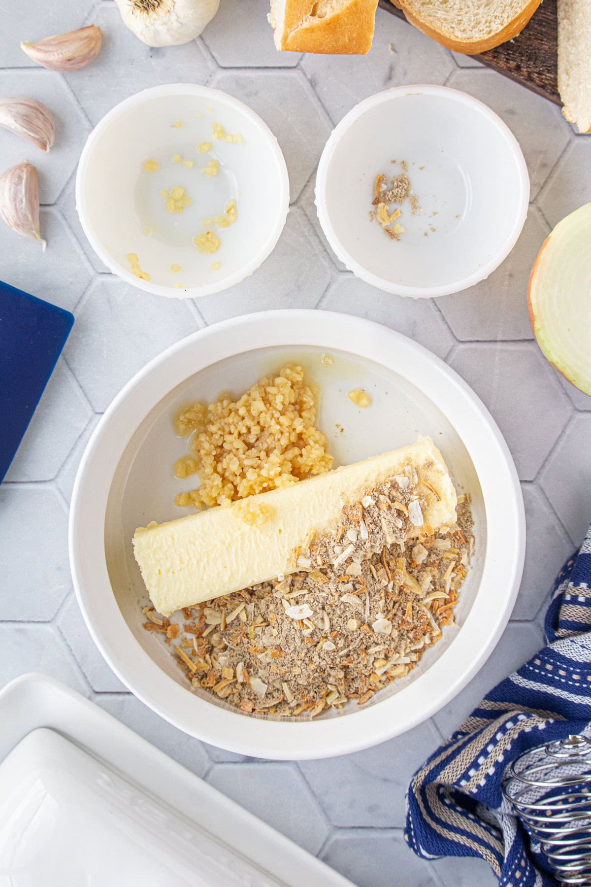 The softened butter, garlic, and French onion soup mix in a bowl.