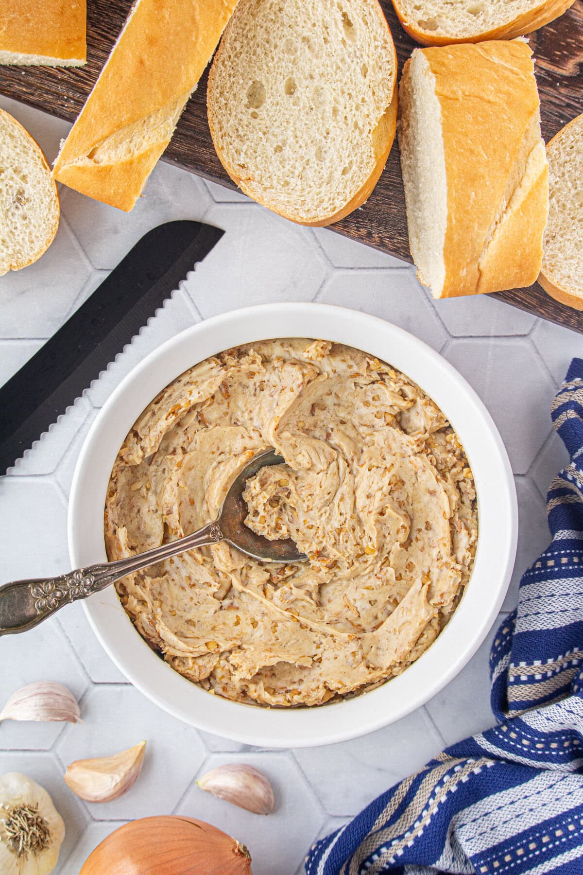 Mixing the French onion butter mixture together.