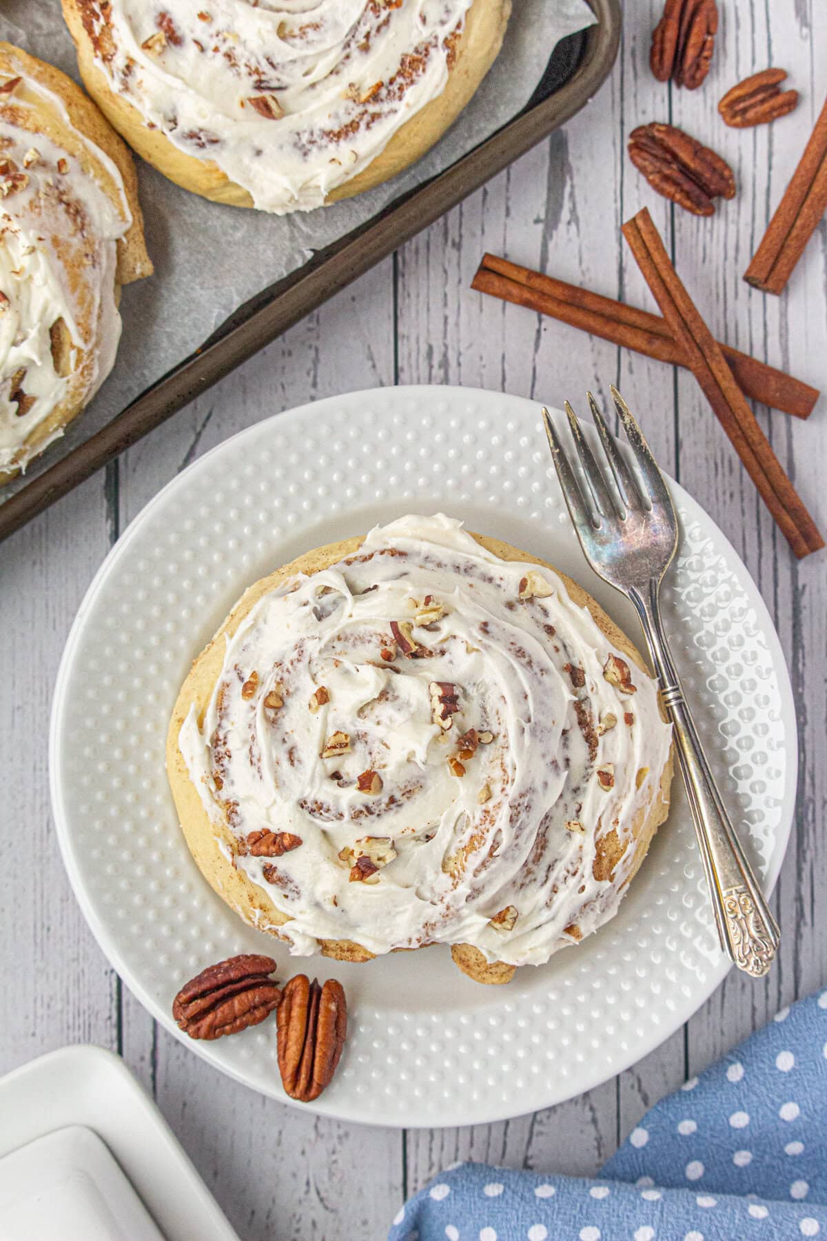 Overhead view of cinnamon rolls on a plate.