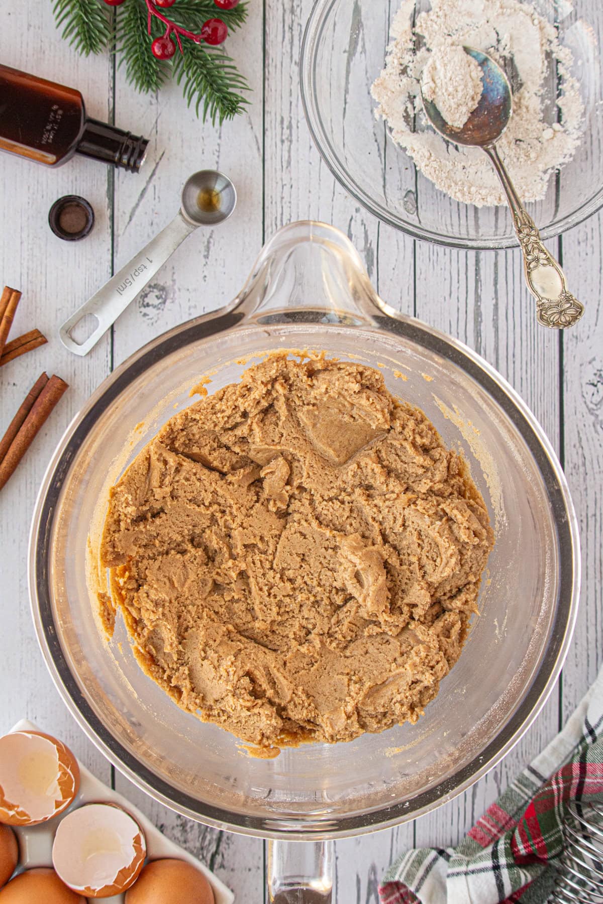 The wet and dry ingredients combined in a mixer bowl.