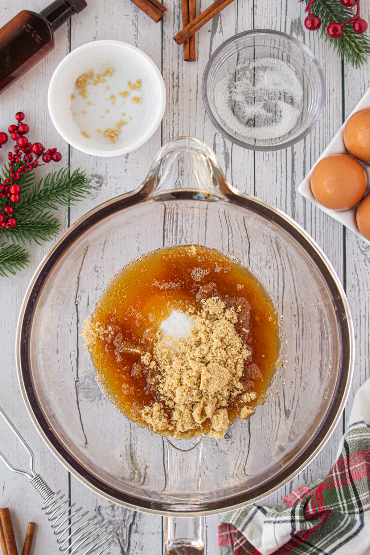 Beating the butter, sugar, and brown sugar together.