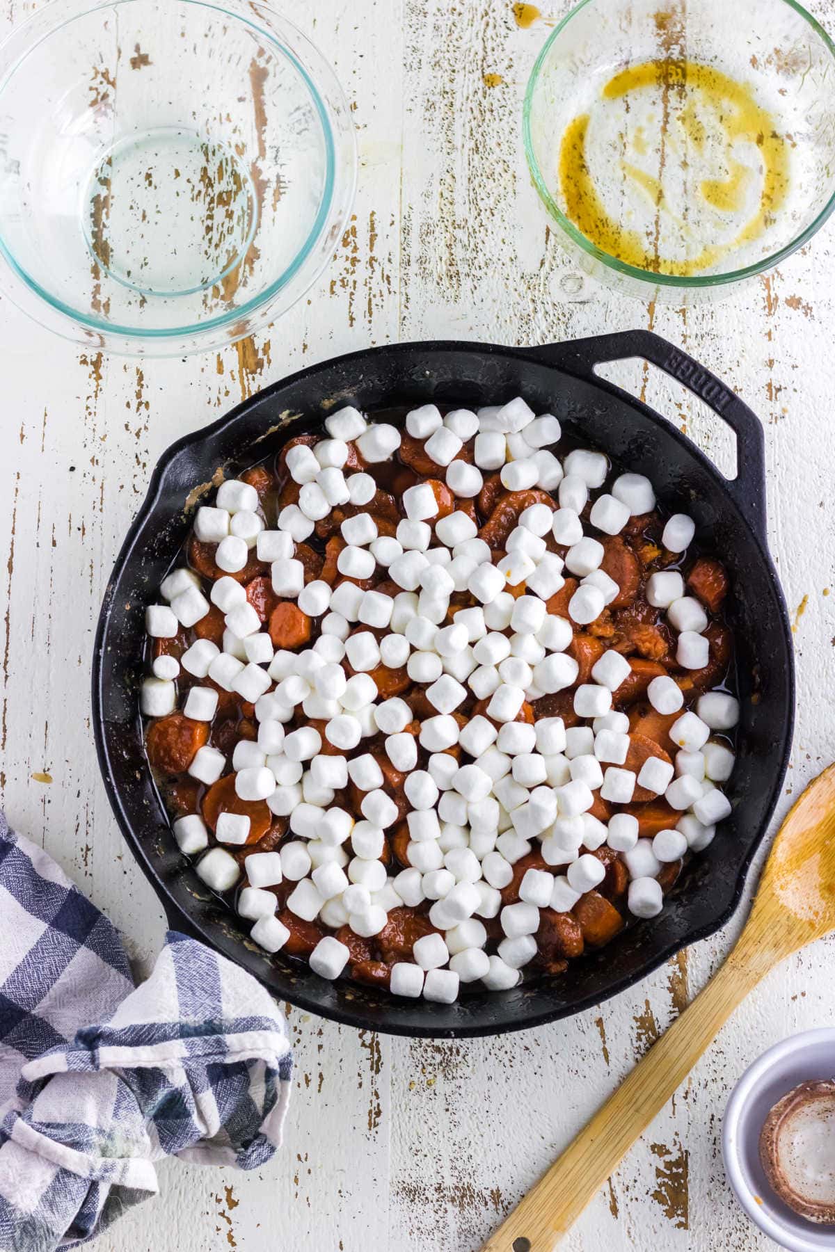 Marshmallows added to the top of the sweet potatoes.