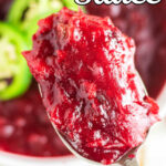 A closeup of a spoonful of jalapeno cranberry sauce with text overlay for Pinterest.