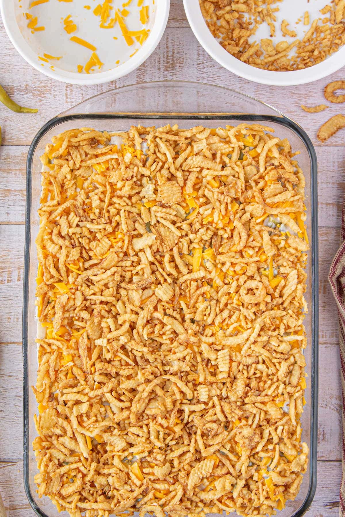 Crispy onions are added to the top of the casserole.