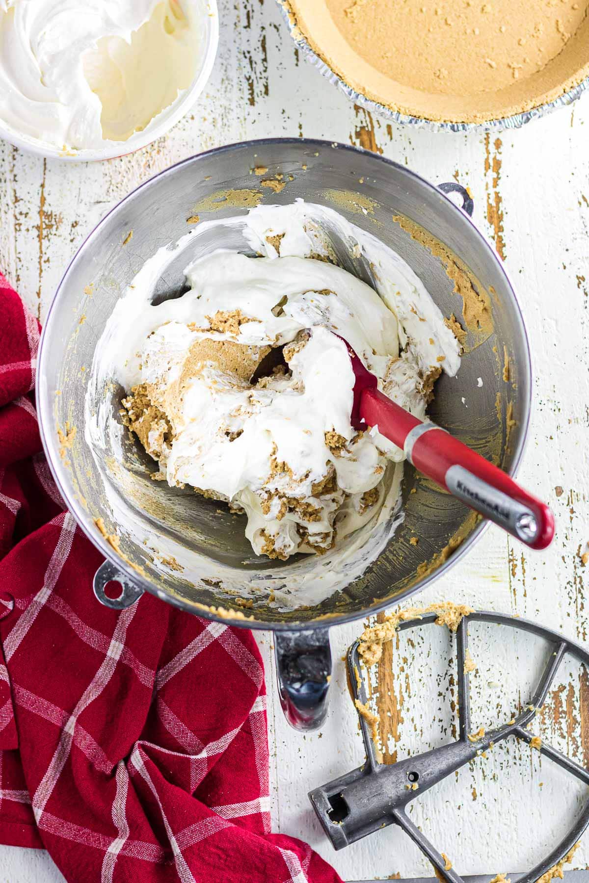 Folding the Cool Whip into the peanut butter mixture.