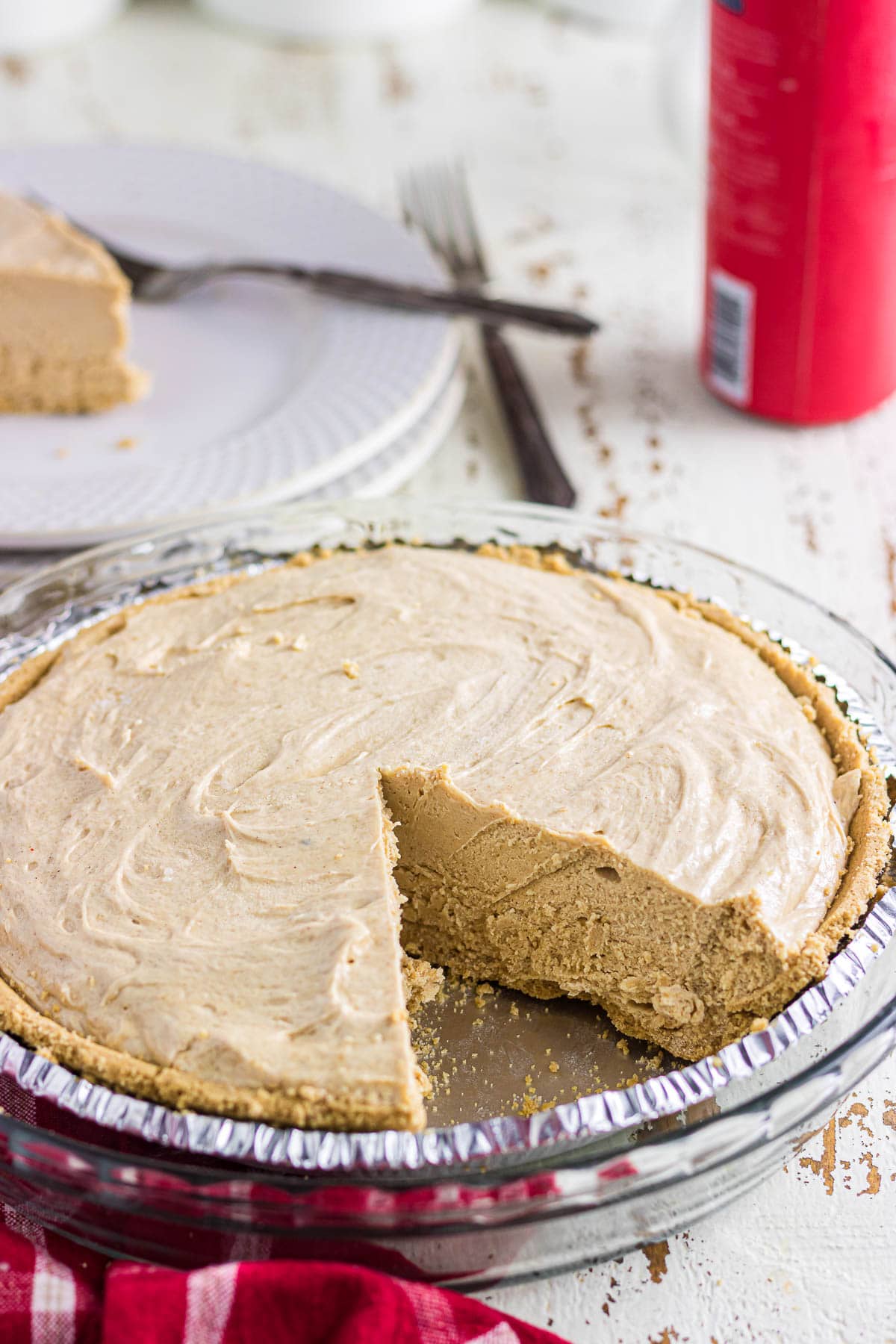 A close-up view of the no-bake peanut butter pie with one slice removed.