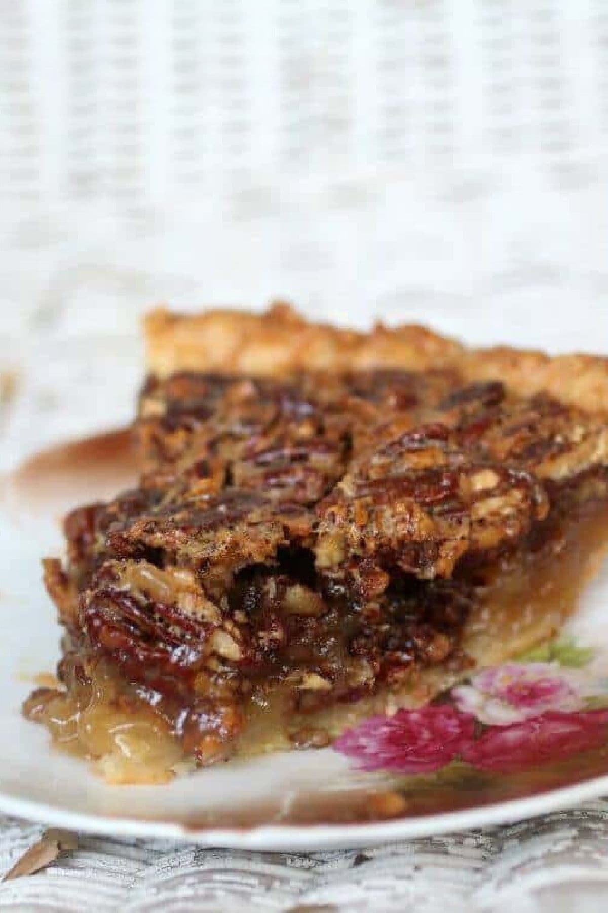 A slice of pecan pie on a plate.