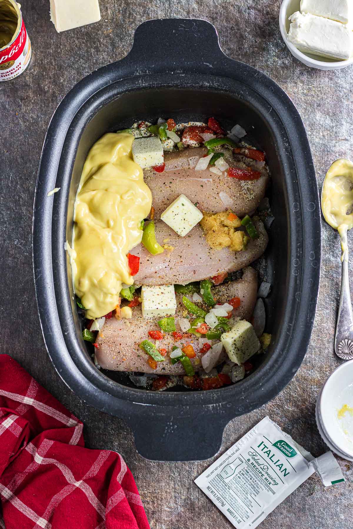 All of the ingredients except the noodles and cheeses in the slow cooker.