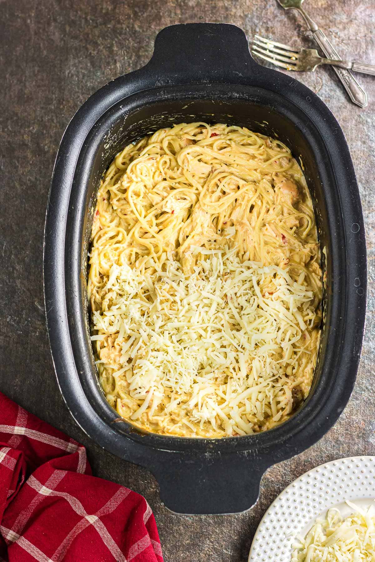 Noodles and remaining Monterey Jack cheese stirred into the slow cooker tetrazzini.