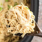 A ladleful of chicken tetrazzini being removed from the slow cooker with a title text overlay on top for Pinterest.