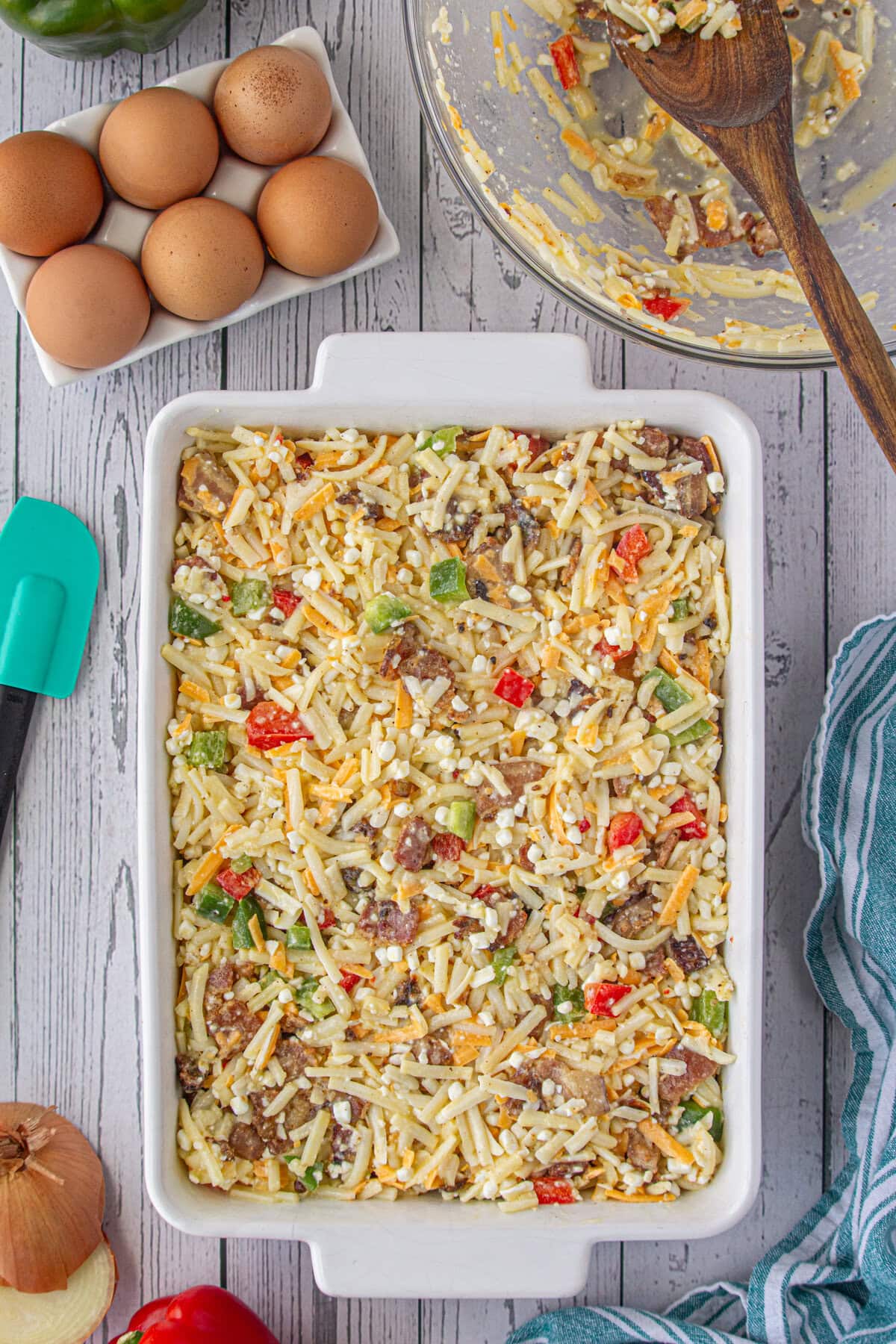 The ingredient mixture spread in a casserole dish.