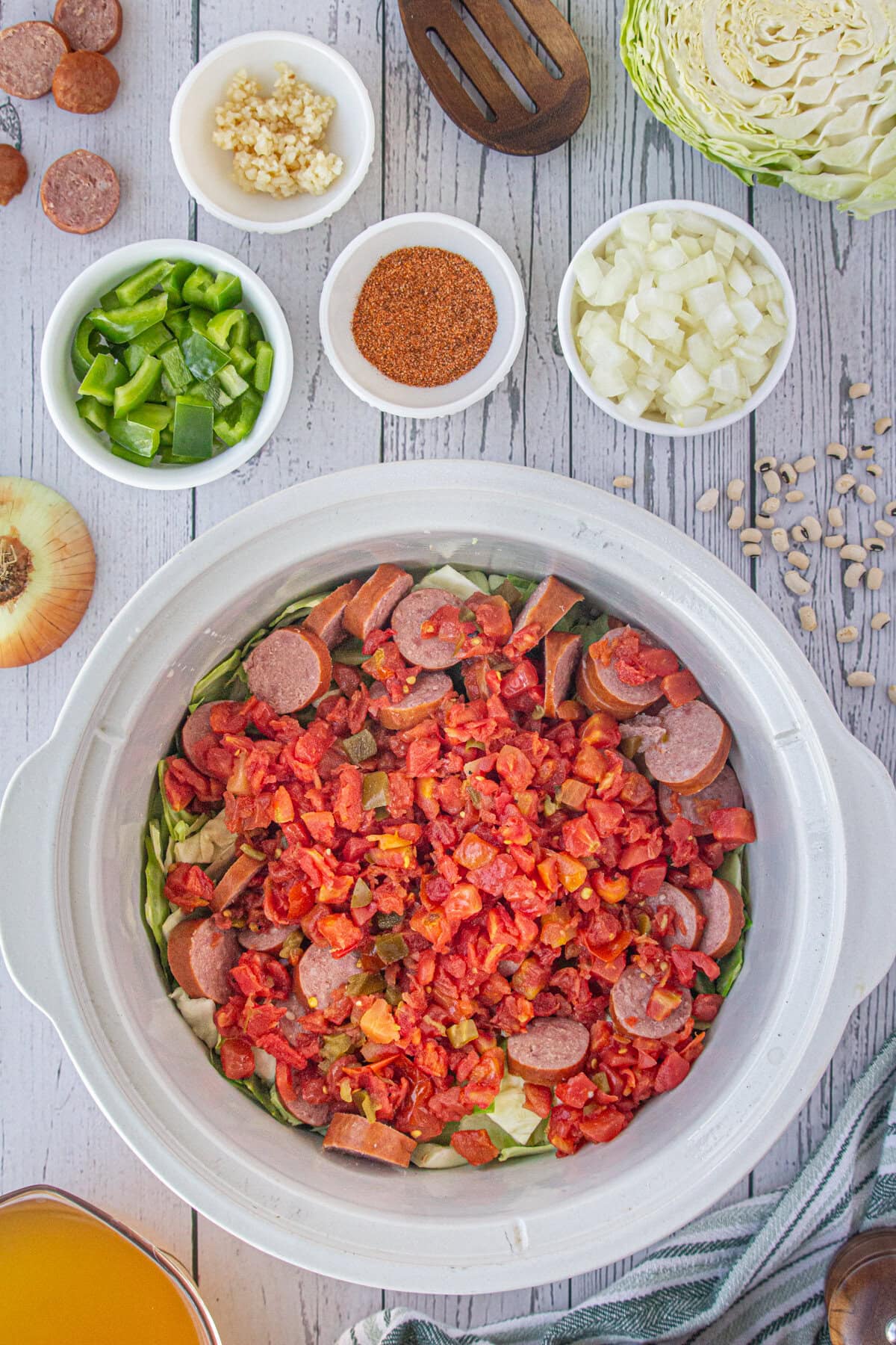 The smoked sausage and tomatoes added to the cabbage.